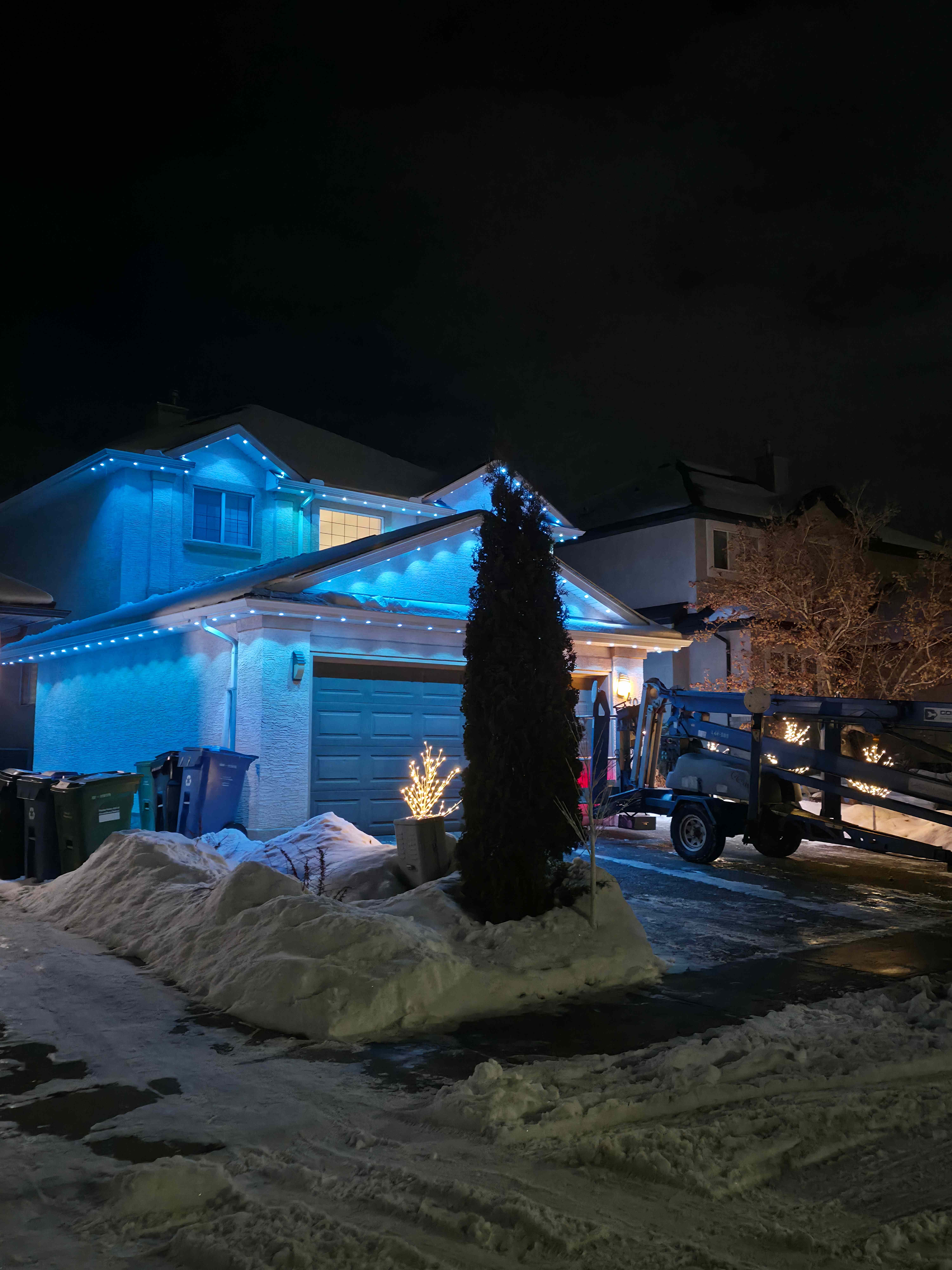 Winter roofline display in crisp cyan with snow on the ground